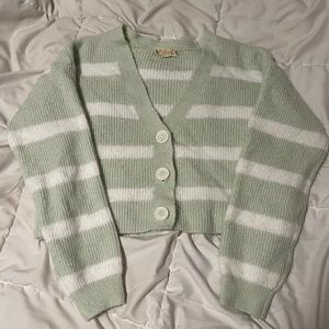 This is a green striped sweater cardigan